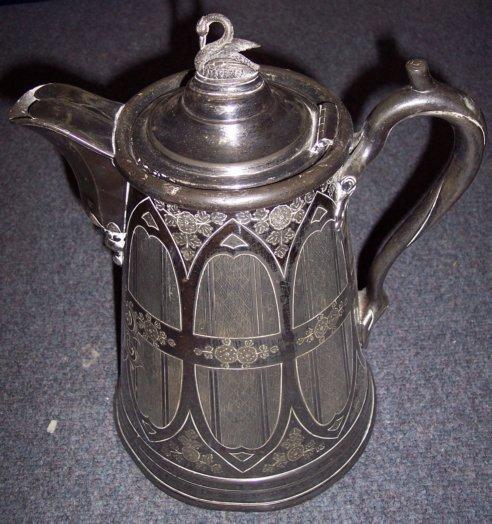 Appraisal: A large pitcher the hinged cover with swan finial the