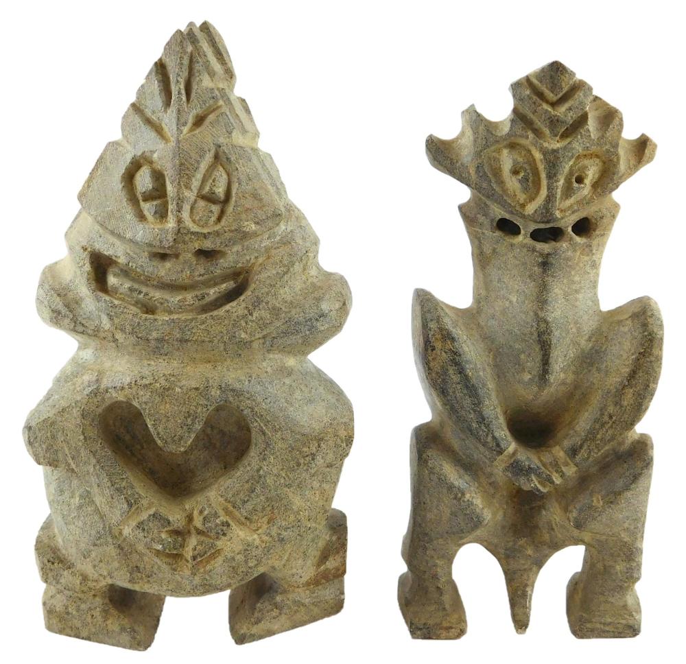 Appraisal: TRIBAL Two Inuit carved stone sculptures of monster like creatures