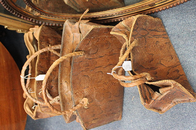 Appraisal: THREE EARLY TH CENTURY SNAKESKIN HANDBAGS the largest cm wide