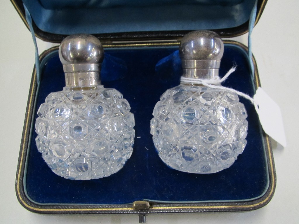 Appraisal: Cased pair of silver topped scent bottles London