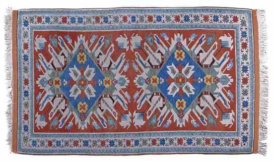 Appraisal: A Kazak Wool Rug having two foliate and diamond form