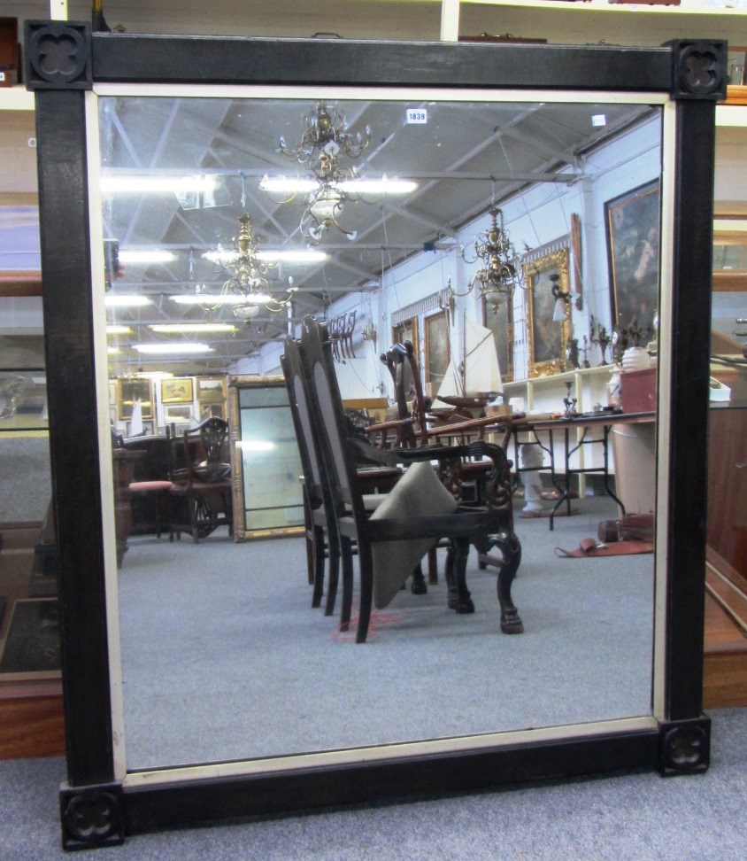 Appraisal: A th century ebonised rectangular mirror with blind quatrefoil decoration