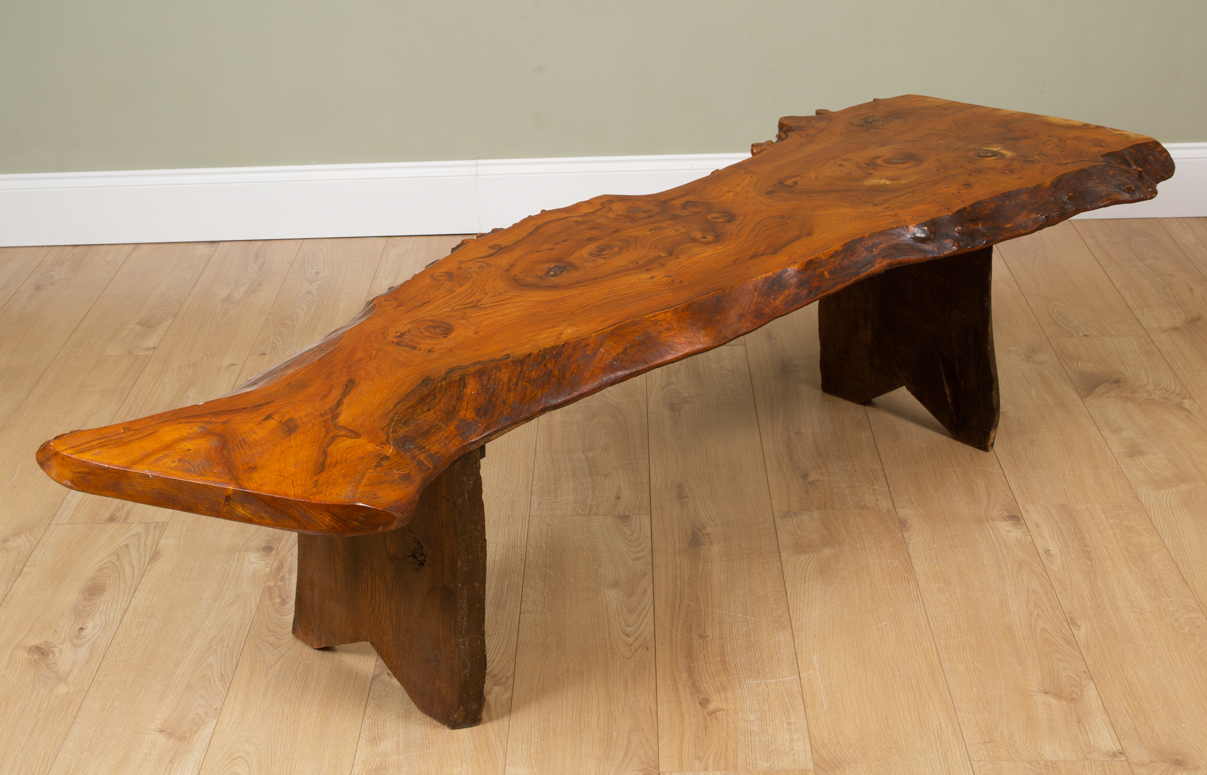 Appraisal: In the manner of George Nakashima a rustic rough-edged plank-top