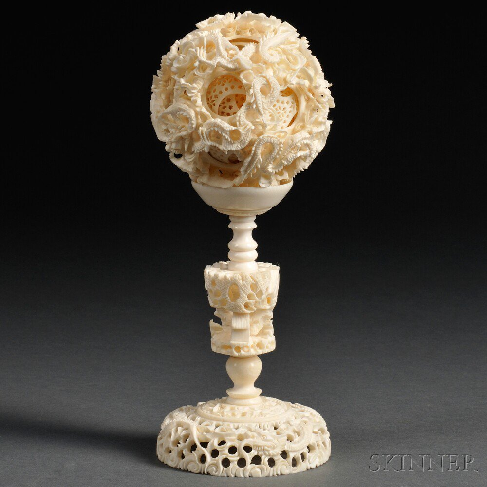 Appraisal: Ivory Puzzle Ball with Holder China th century decorated in