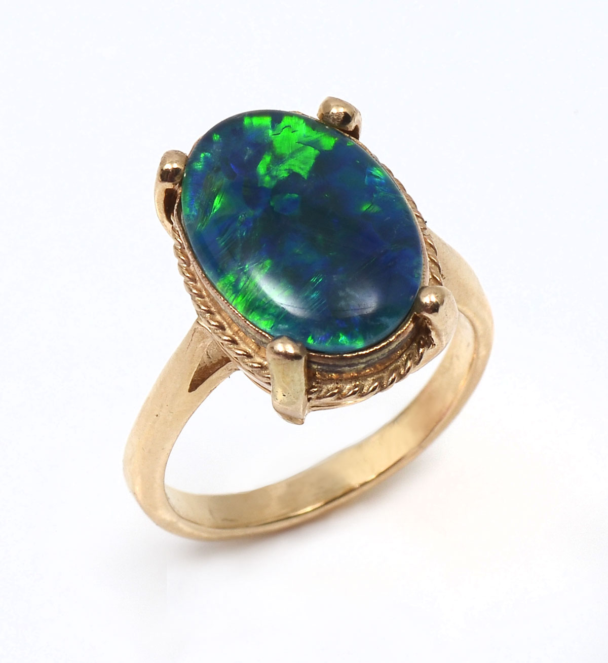 Appraisal: K OPAL TRIPLET RING K yellow gold ring contains one