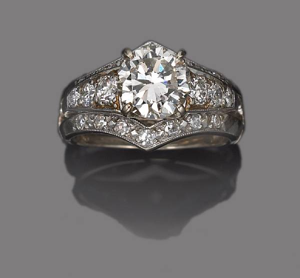 Appraisal: A diamond ring accompanied by a diamond ring insert centering