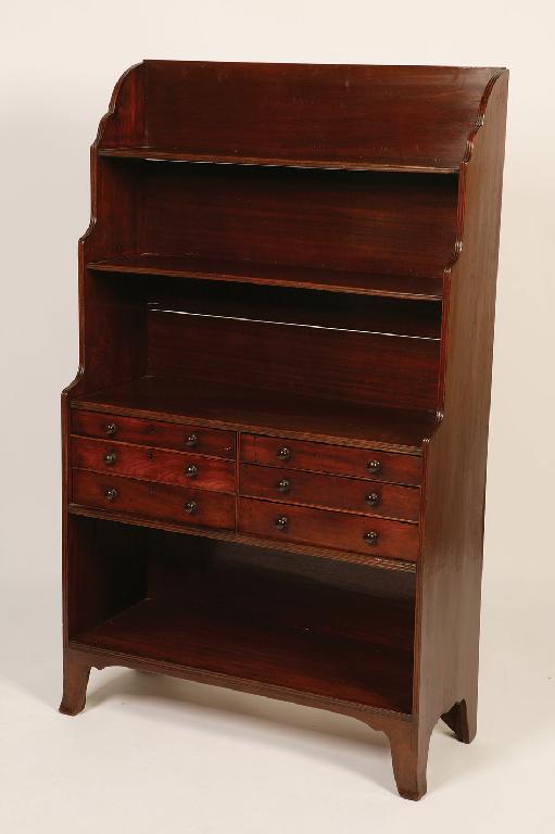 Appraisal: A REGENCY MAHOGANY WATERFALL BOOKCASE with two open shelves above