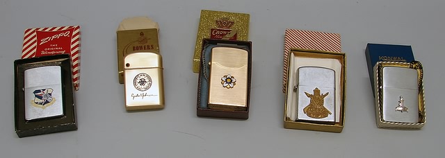 Appraisal: Grouping of five lighters including Zippo lighter featuring Strategic Air