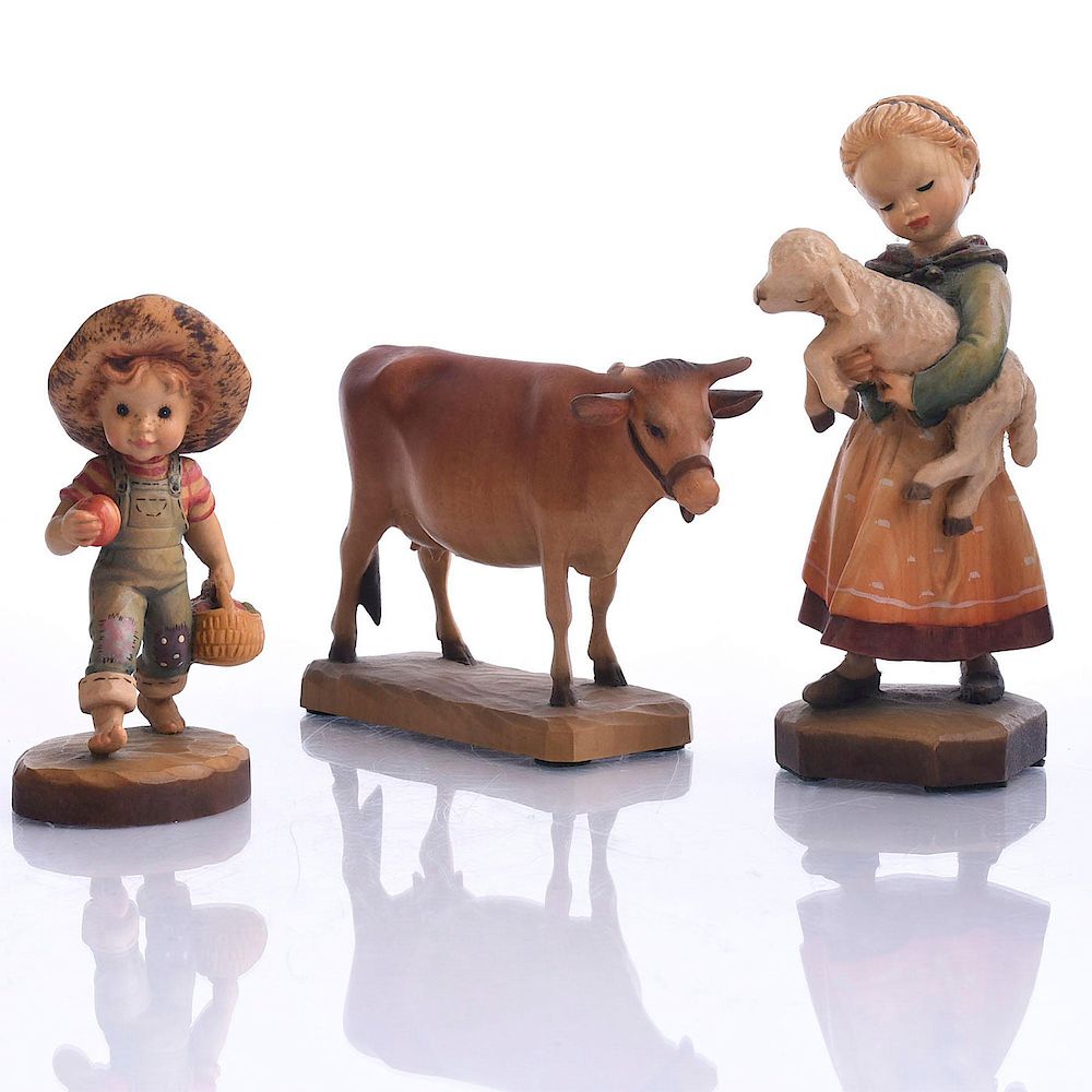 Appraisal: TYROLEAN ANRI CHILD AND ANIMAL WOOD FIGURES Three hand decorated