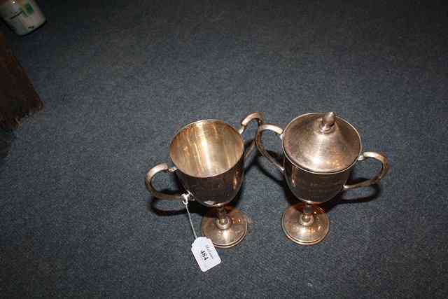 Appraisal: A PAIR OF MEXICAN SILVER TWO HANDLED TROPHY CUPS one