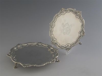 Appraisal: A pair of George II waiters with shell and scroll