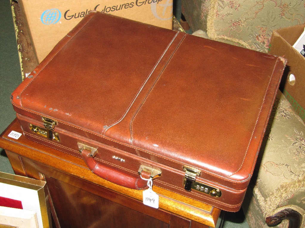 Appraisal: Leather briefcase with auction catalogues