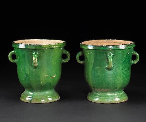 Appraisal: A pair of French glazed terracotta jardini res Each of