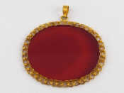 Appraisal: A yellow metal tests high carat gold and agate pendant