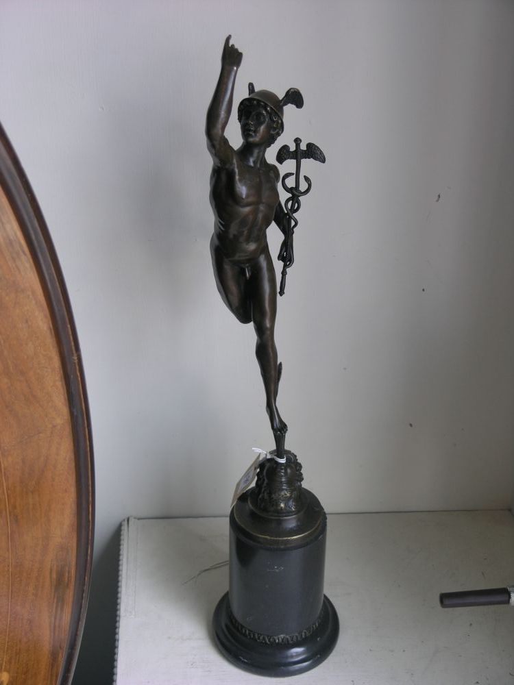 Appraisal: A reproduction bronze figure of 'Mercury' standing upon cylindrical black