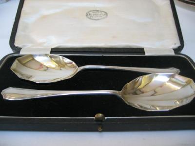 Appraisal: A PAIR OF ART DECO FRUIT SERVING SPOONS maker Henry