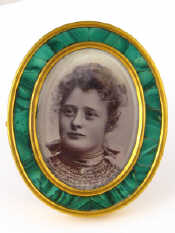 Appraisal: A Russian oval photo frame the gilt mounted malachite frame