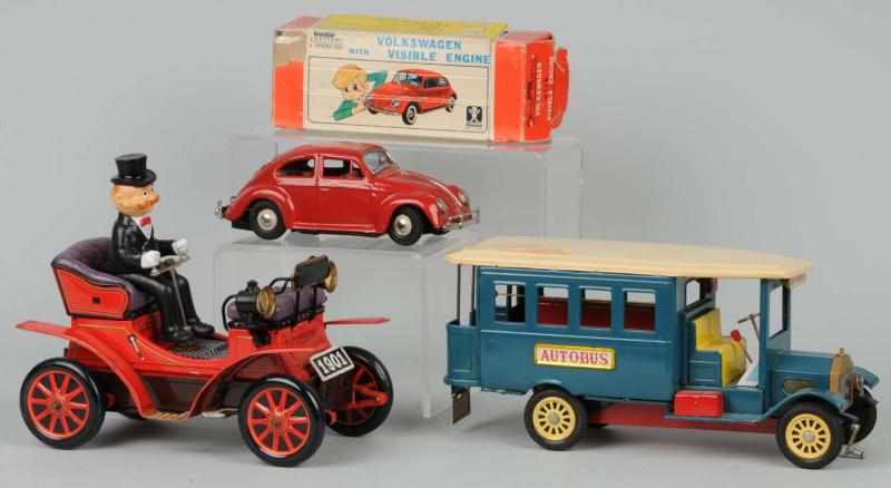 Appraisal: Lot of Tin Vehicle Friction Battery-Op Toys Description Japanese Working