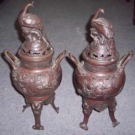 Appraisal: A pair of bronzed metal koros and covers each with