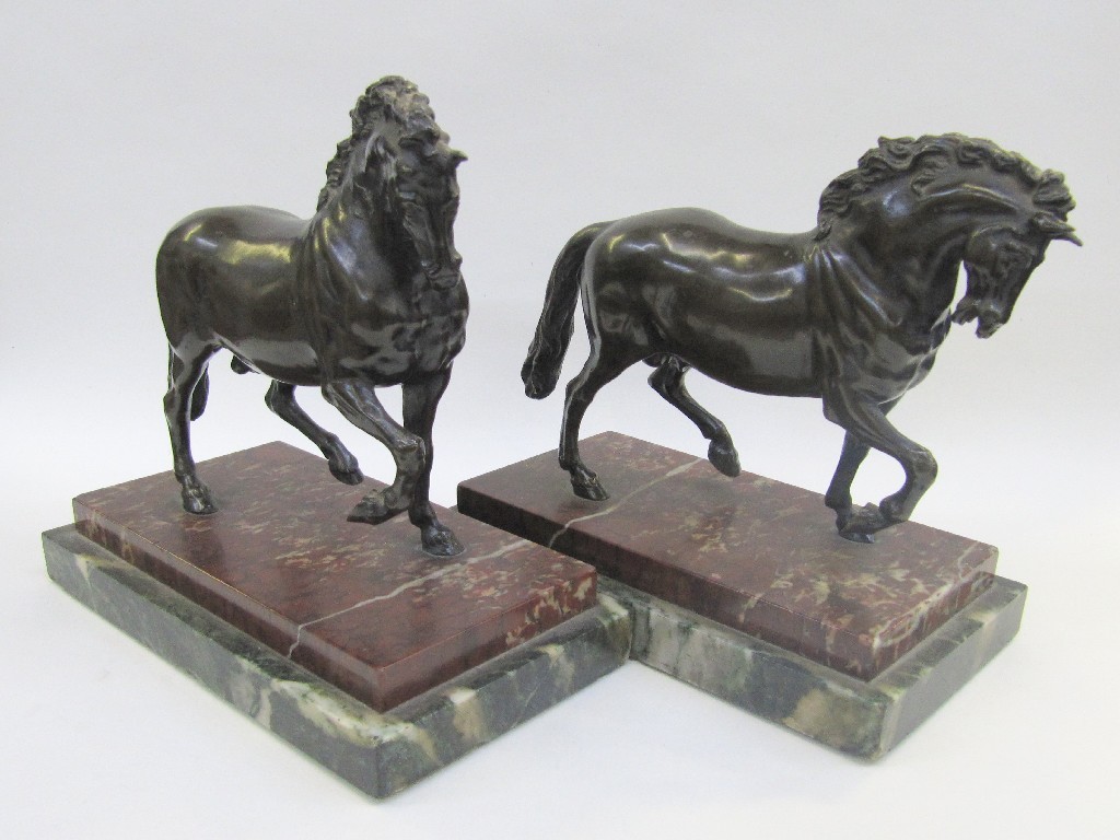 Appraisal: Pair of bronze figures of horses upon red and green