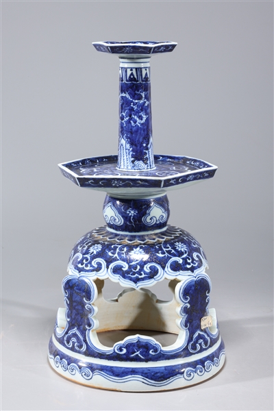 Appraisal: Chinese blue and white porcelain candlestick with floral designs and