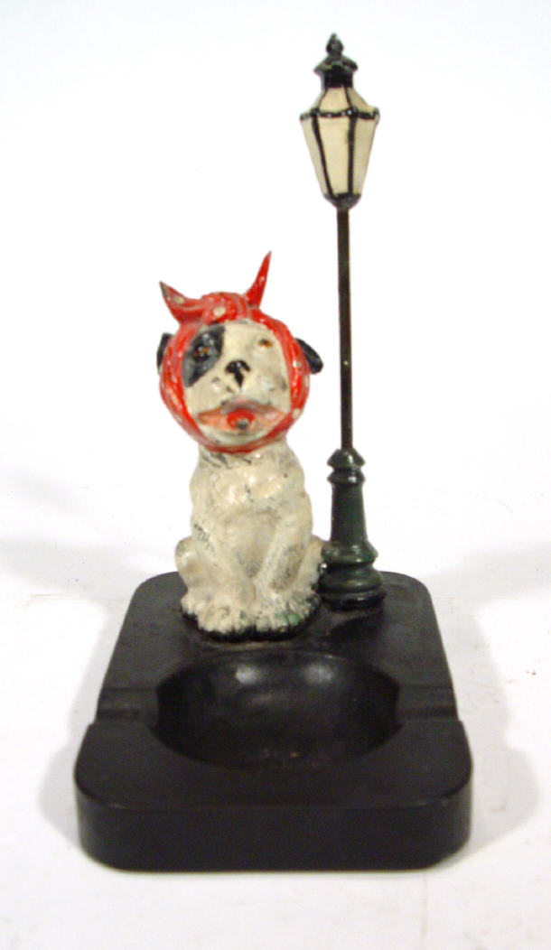 Appraisal: Painted metal dog ashtray under a streetlamp on a composite