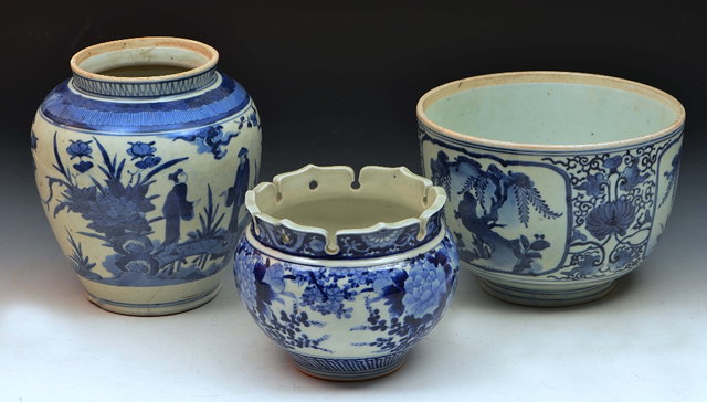 Appraisal: Japanese Arita blue and white vasefigures in a garden cm