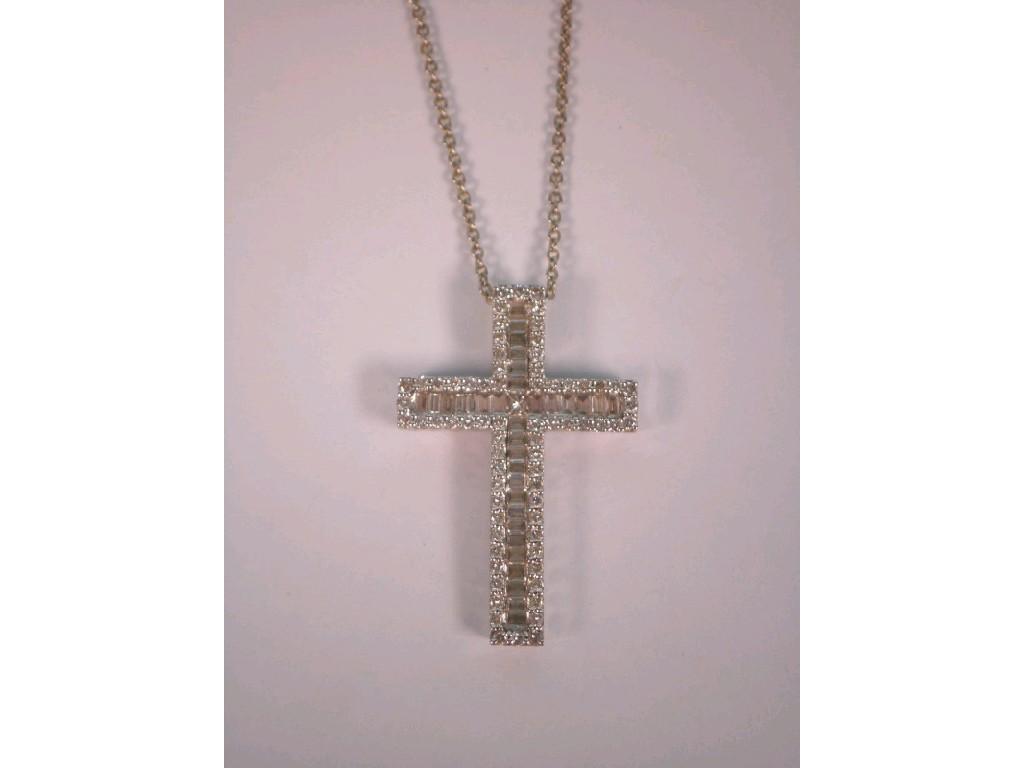 Appraisal: A diamond set crucifix a mix of baguette and brilliant