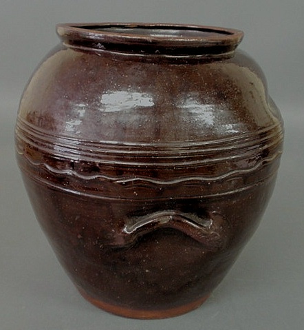 Appraisal: Redware ovoid jar with incised wriggle banding probably Pennsylvania or