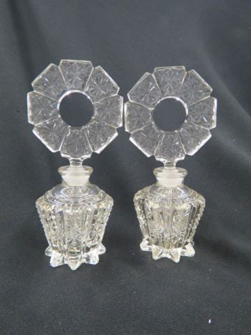 Appraisal: Pair of Czechoslovakia Cut Crystal Perfumes disc stoppers