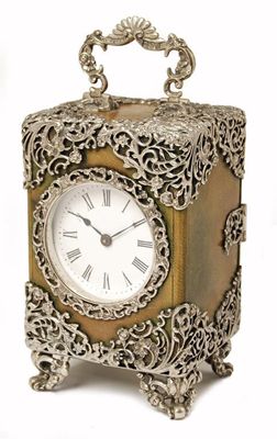 Appraisal: A silver mounted leather cased 'carriage' clock with a platform