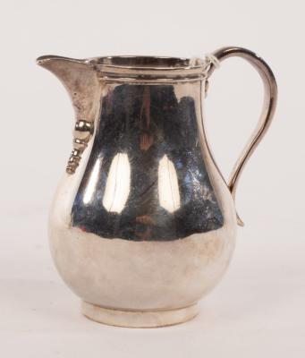 Appraisal: A silver pear-shape cream jug Arthur Martin Parsons Frank Herbert