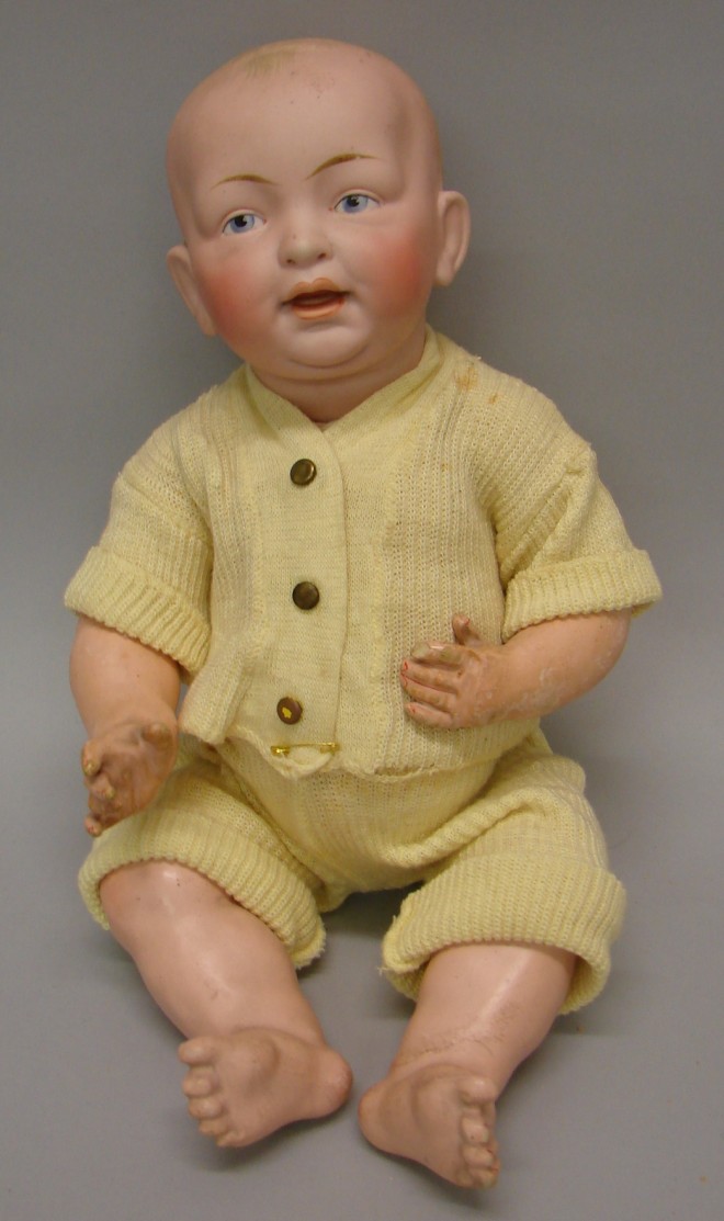 Appraisal: L cir Solid dome character baby with painted blue eyes