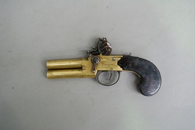 Appraisal: A British tap action over and under flint lock pistol