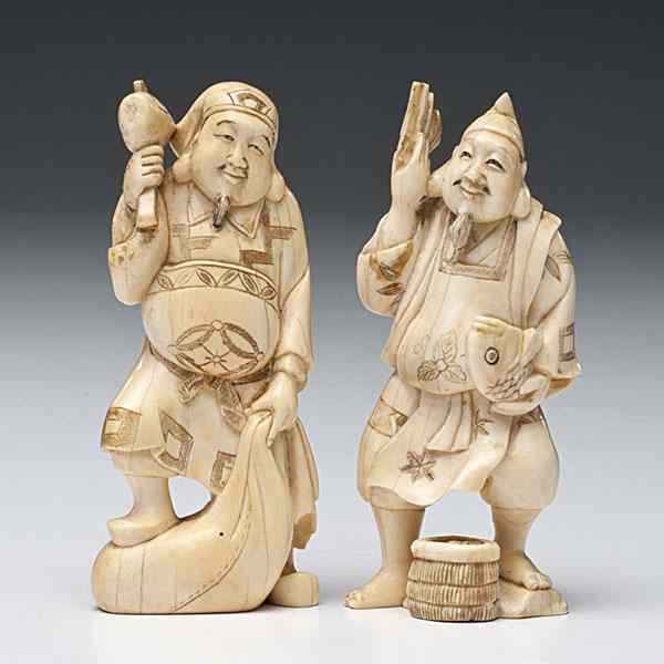 Appraisal: Japanese Okimono Carvings th century two ivory figural carvings of