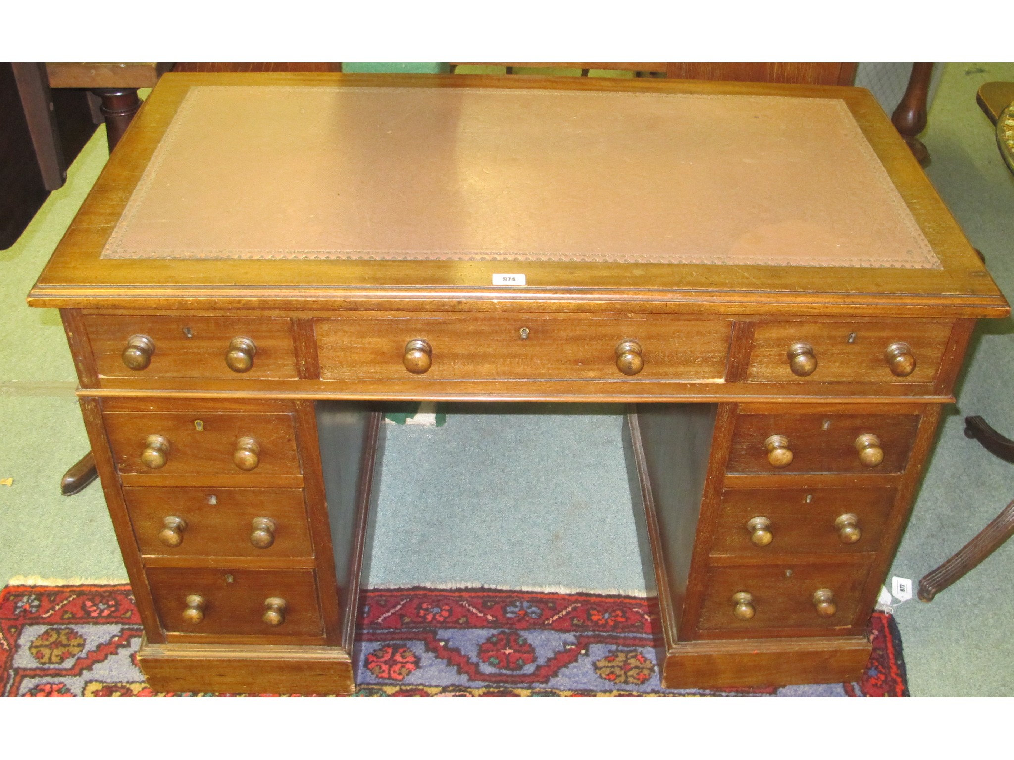 Appraisal: An Edwardian leather top mahogany pedestal desk