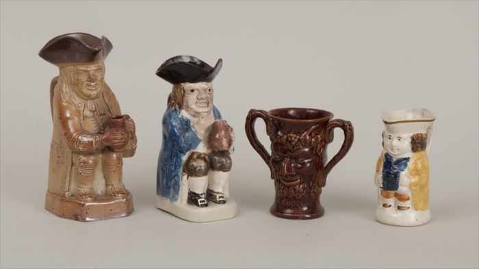 Appraisal: FOUR STAFFORDSHIRE POTTERY MUGS Largest in