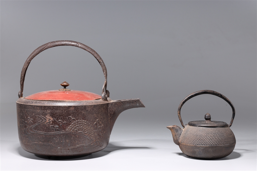 Appraisal: Two antique Japanese pots including sake pot and teapot each