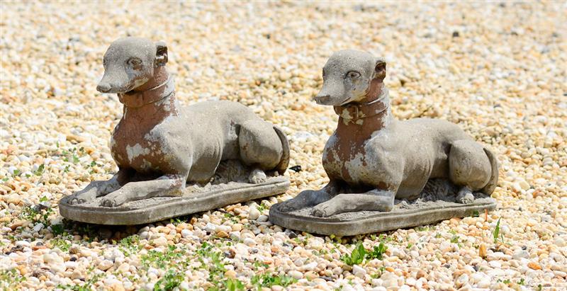 Appraisal: PAIR OF ENGLISH CAST STONE RECUMBENT WHIPPETS Each with collars