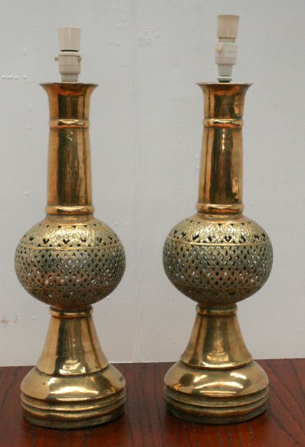 Appraisal: A pair of pierced brass table lamp bases cms high