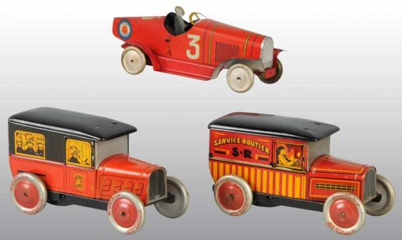 Appraisal: Lot of Tin Vehicle Wind-Up Toys Description French Working Includes