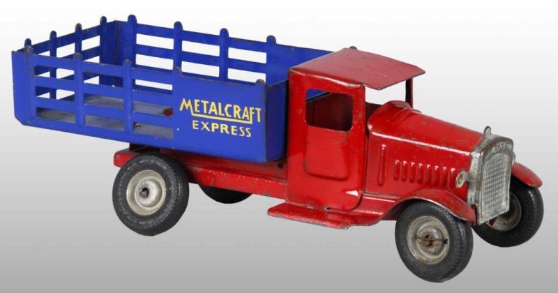 Appraisal: Pressed Steel Metalcraft Express Truck Toy Description American Stake back