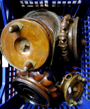 Appraisal: Two vintage brass-mounted teak salmon reels un-named cm and cm