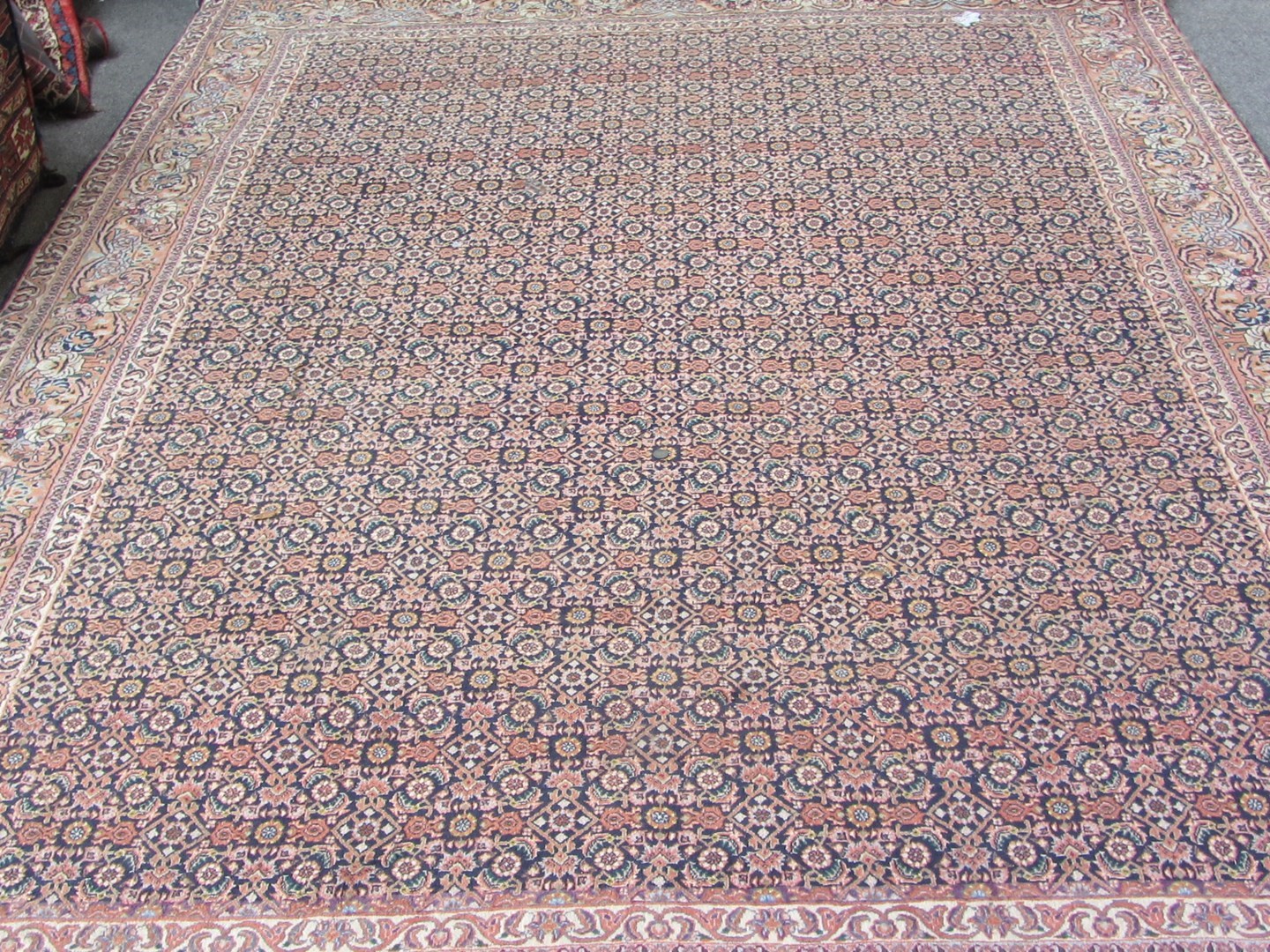 Appraisal: A Sarough carpet Persian the field filled with a herate