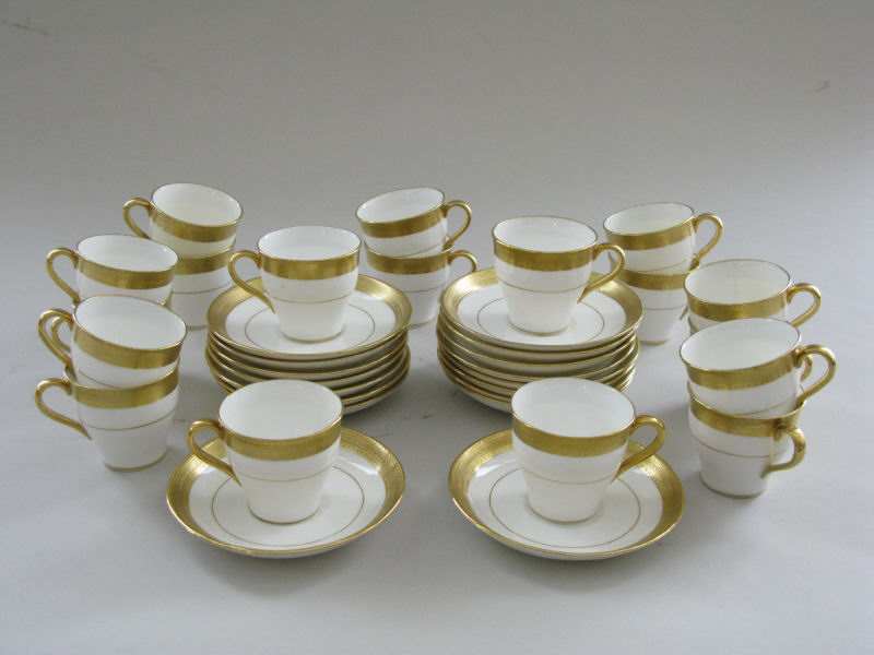 Appraisal: Minton Demitasse Set Pattern H white with gold band having