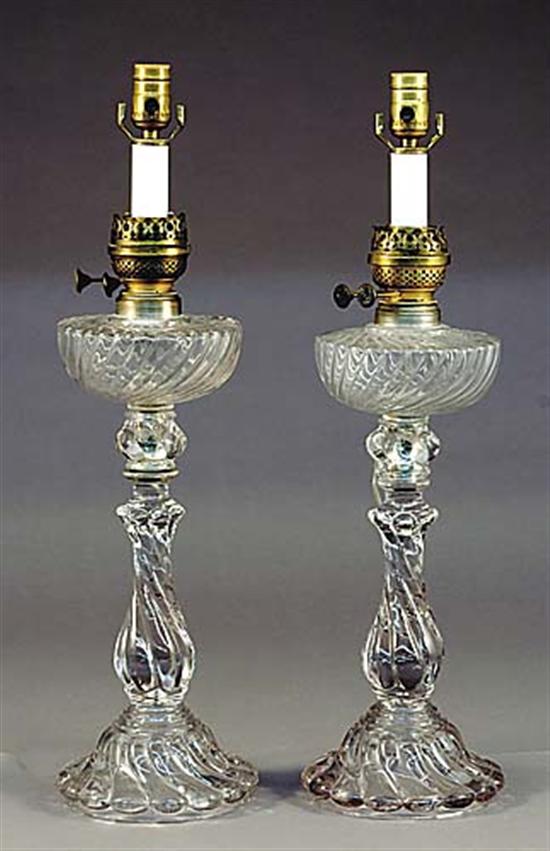 Appraisal: Pair Baccarat style molded glass and brass oil lamps turned