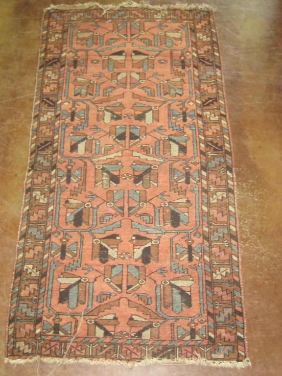 Appraisal: An old bordered Oriental Rug with geometric design in blue