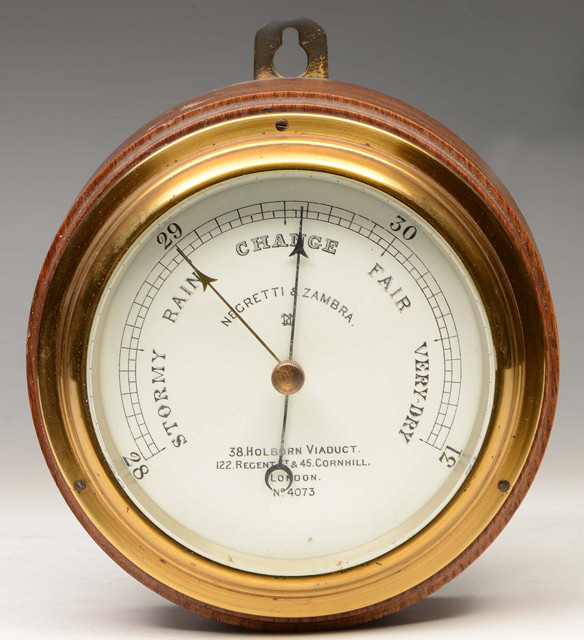 Appraisal: A NEGRETTI ZAMBRA ANEROID WALL BAROMETER the signed white enamelled