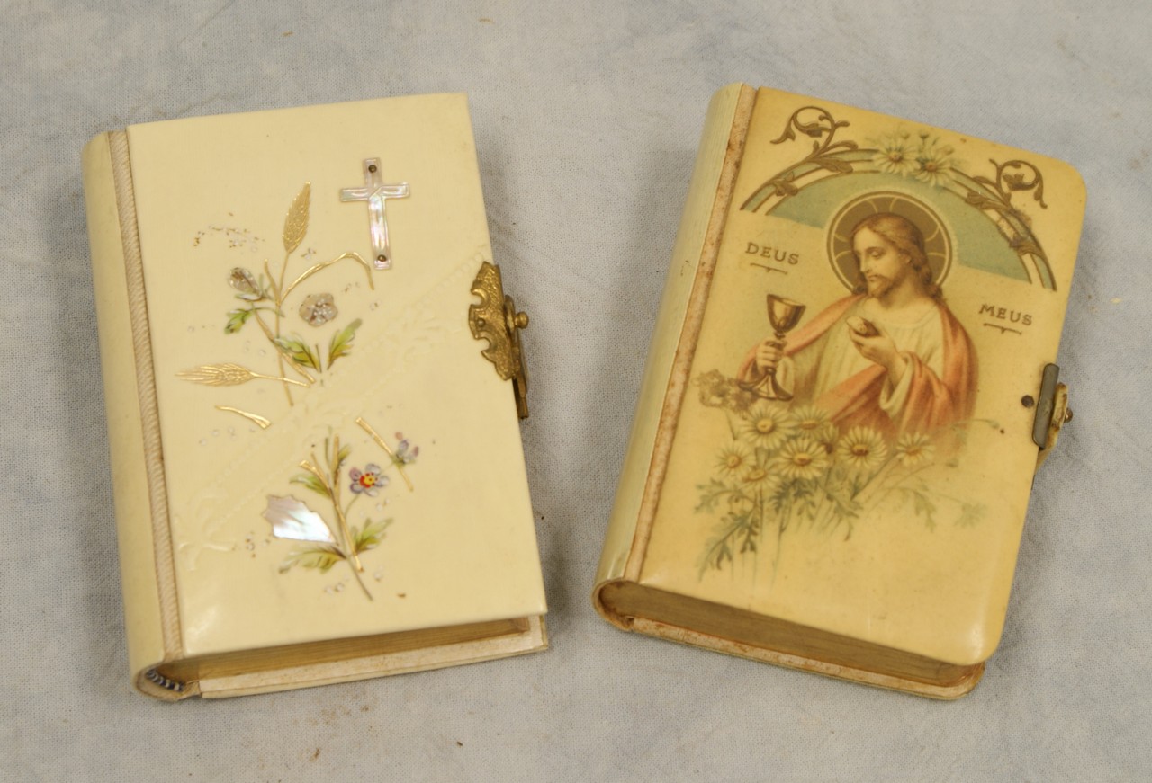 Appraisal: Celluloid Miniature Bibles both with mother of pearl crucifix one