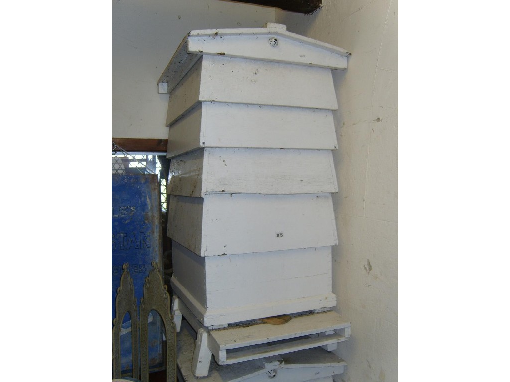 Appraisal: A sectional beehive with pitched roof and painted finish